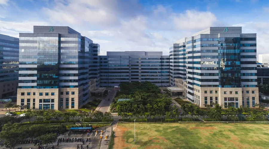 Glass office campus set around a green courtyard