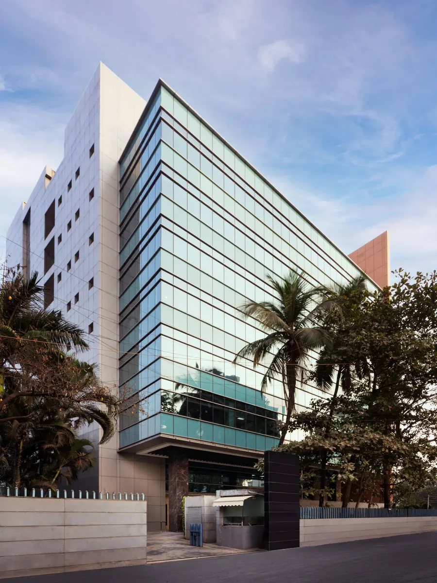 Office tower framed by palm trees