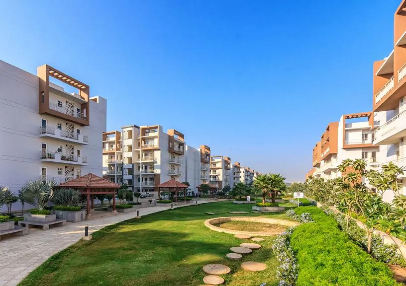Landscaped lawns between modern apartment towers
